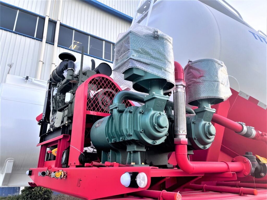 Air compressor powering pneumatic discharge system on ZW bulk powder trailer