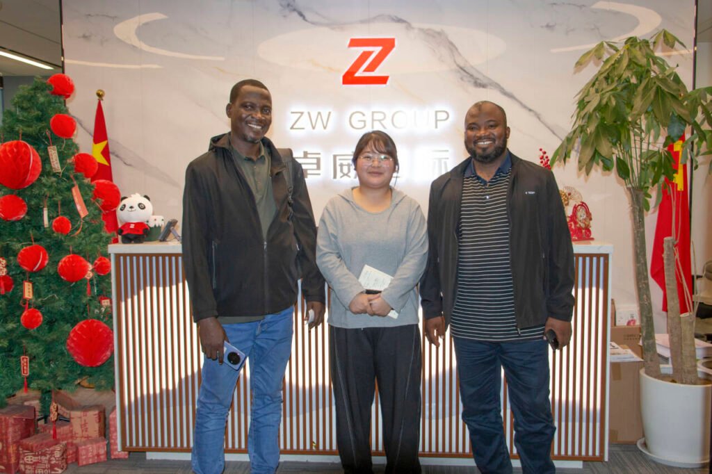 Nigeria client and ZW Group team taking a group photo during visit for cement tanker trailer and HOWO NX truck cooperation