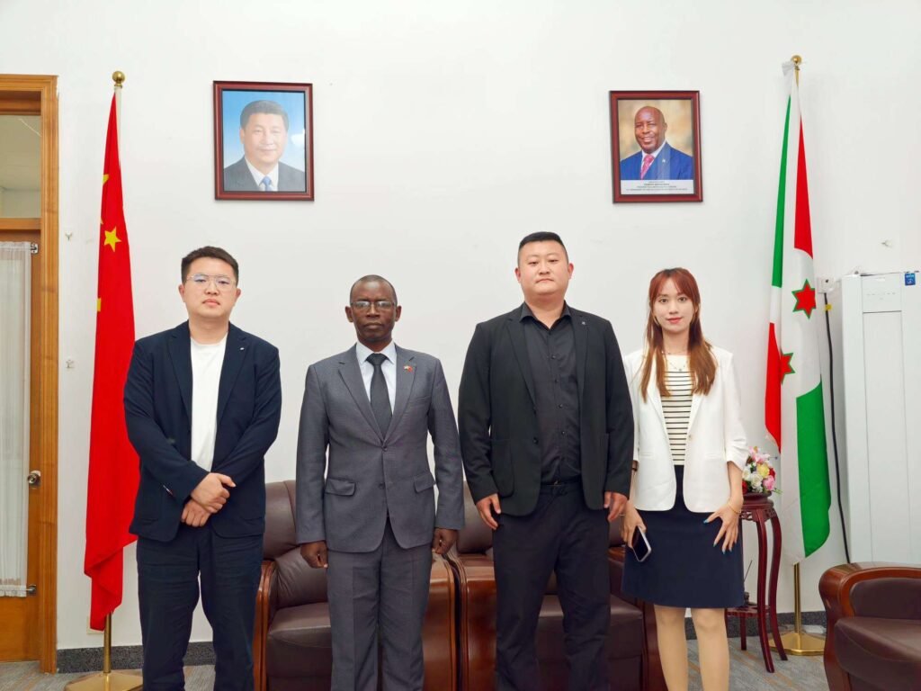 Chairman Ivan Sun, GM Pierce Guo, and Secretary-General Vera Jiang with Burundi Ambassador Telesphore Irambona.