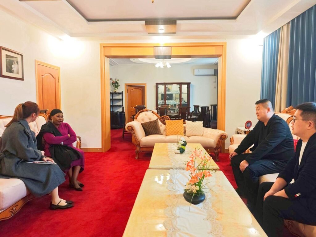 Chairman Ivan Sun discussing heavy-duty tipper trailer designs for rugged mining terrains with the Guinean Ambassador.